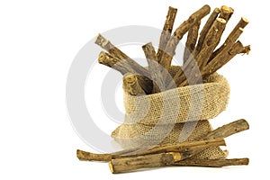 Licorice root (sticks) in a burlap bag