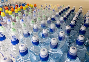 Lid plastic water bottle in the market multi-colored plastic bottle caps.