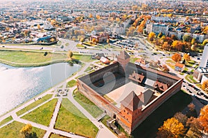 Lida, Belarus. Aerial Bird's-eye View Of Cityscape Skyline. Lida Castle In Sunny Autumn Day. Famous Popular