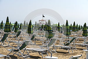 LIDO DI JESOLO, ITALY - May 24, 2019 : Umbrellas on the beach of Lido di Jesolo at adriatic Sea in a beautiful summer day, Italy.
