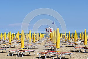 LIDO DI JESOLO, ITALY - May 24, 2019 : Umbrellas on the beach of Lido di Jesolo at adriatic Sea in a beautiful summer day, Italy.