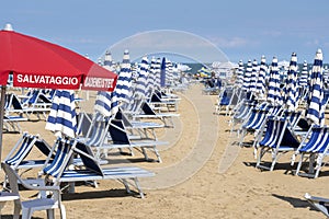 LIDO DI JESOLO, ITALY: Umbrellas on the beach of Lido di Jesolo at adriatic Sea in a beautiful summer day, Italy. On the beach of