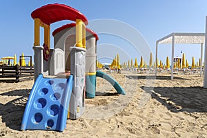 LIDO DI JESOLO, ITALY: Umbrellas on the beach of Lido di Jesolo at adriatic Sea in a beautiful summer day, Italy. On the beach of