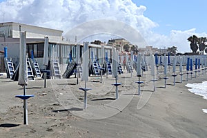 Lido di Ostia - Ombrelloni chiusi sulla spiaggia del Lido Urbinati photo