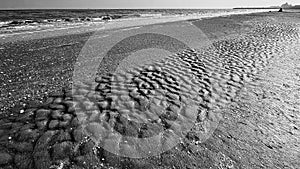 Lido di Venezia, footprints on the beach and sea. photo