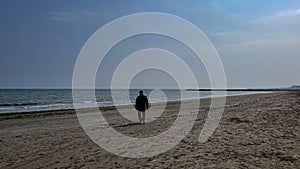 Lido di Venezia, man on the beach, sea and blue sky. photo
