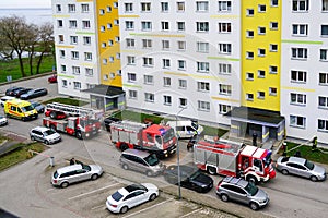 Liepaja, Latvia- April 08, 2024: Three fire engines, police and ambulances at apartment building