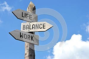 Life, balance, work - crossroads sign with three arrows