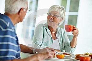 Life begins after coffee. Cropped shot of a senior couple eating breakfast.