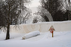 A Life boat and a Life Buoy by a Frozen River