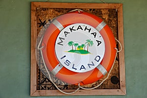 Life bouy on the wall at Makaha`a island near Tongatapu island i