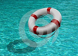 Life buoy on blue water