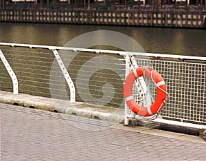 Life buoy on embankment for help and assistance