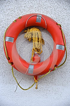 Life buoy hanging on wall stock photo