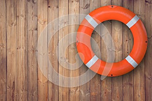 Life buoy hanging on wooden wall for emergency response when people sinking to water almost place near pool and beach.