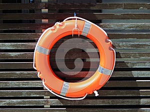 Life buoy, lifesaver at the wooden wall