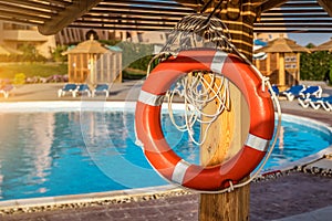 Life Buoy near the pool at sunset