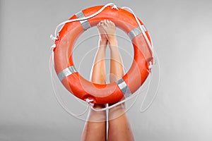 Life buoy ring on female legs