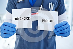 Life, choice and doctor with paper in hands for abortion, human rights or decision in clinic. Nurse, poster and vote for