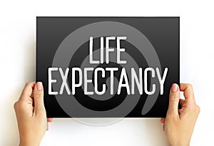 Life expectancy - statistical measure of the average time an organism is expected to live, text on card concept