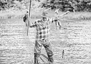 life full of new Hobbies. summer weekend. fisherman with fishing rod. mature man fishing. retired bearded fisher. big