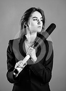 Life game. Pretty and dangerous. Woman pretty girl bear formal jacket and hold baseball bat. Business strategy