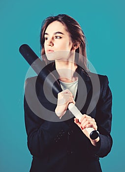 Life game. Pretty and dangerous. Woman pretty girl bear formal jacket and hold baseball bat. Business strategy