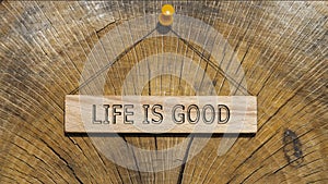 Life is good written on the wooden surface. Wooden Concept