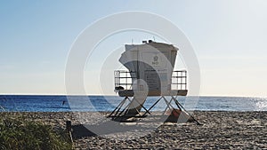 Life Guard Hut on Beach Against Blue Sky