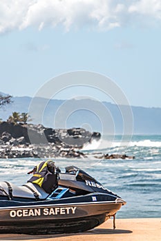 Life Guard Jet Ski with Blurred Rocky Ocean Background