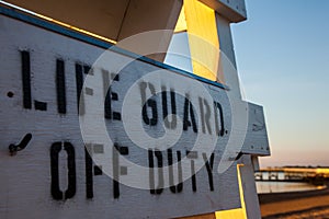 Life guard off duty sign on beach