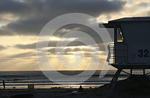 Life Guard Tower in Silhouette at the Beach at Sunset