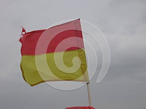 Life guards flag fluttering in the wind