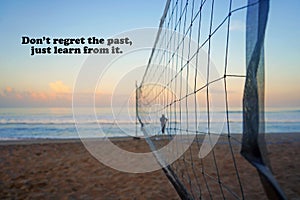 Life inspirational and motivational quote - Don't regret the past, just learn from it. With sport net the beach at sunrise.