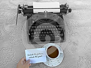 Life inspirational quote - Inhale the future, exhale the past. Note on paper with coffee and old typewriter vintage.