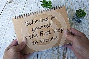 Life inspirational quote text on notepad - Believing in yourself is the first step to success.