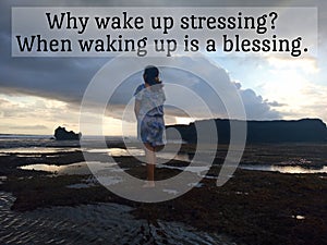 Life inspirational quote - Why wake up stressing when waking up is a blessing. With young woman standing on the beach at sunset.