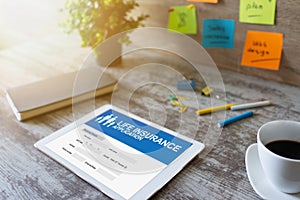 Life insurance online application form on device screen.