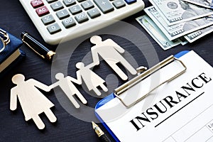 Life insurance. Policy and figures of family.