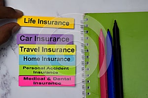 Life Insurance text on sticky notes with keywords isolated on office desk