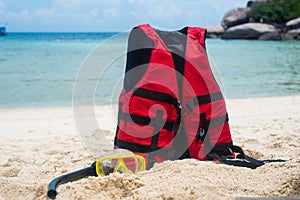 Life jacket and a mask for snorkeling on the beach