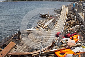 Life Jackets discarded and sunken Turkish boat in the port. Many refugees come from Turkey in an boats.