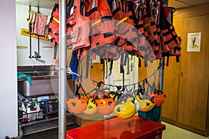 Life jackets and helmets on board of the Greenpeace Raimbow Worrior Boat, anchored in the port of Genoa, Italy.