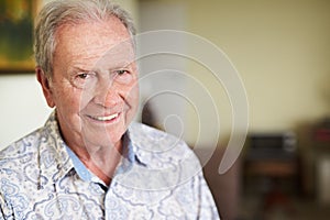 Life just gets better with each year. Portrait of a happy senior man feeling relaxed at home.