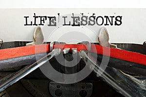 Life Lessons are shown using the text on typewriter photo
