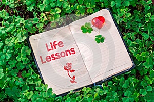 Life lessons text in notebook photo