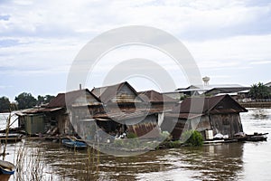 Life and lifestyle thai people and abandoned house or damage broken rafthouse floating on Chao Phraya and Ping river with rapid