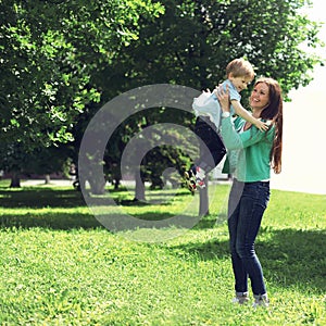 Life moment of happy family! Mother and son child playing