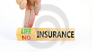 Life or no insurance symbol. Concept words Life insurance No insurance on wooden blocks. Beautiful white background. Businessman