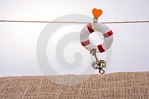 Life preserver attached to a string with heart